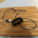Tractive Cat Mini Tracker Charger (black). Fixed Price $12.99.